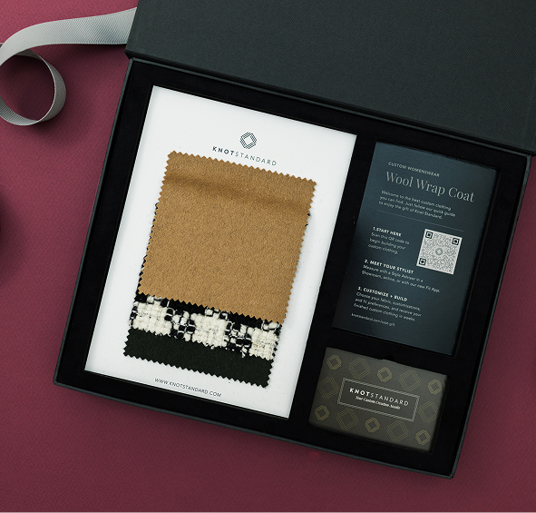 Stylized blue and pink image of a whiskey glass with the wordmark of Vèloce in pink all-caps letters above.