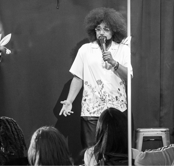 Stylized blue and pink image of a whiskey glass with the wordmark of Vèloce in pink all-caps letters above.